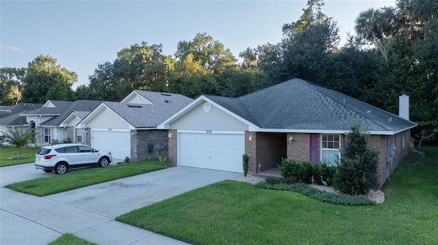 ranch-style house featuring a front yard and a garage