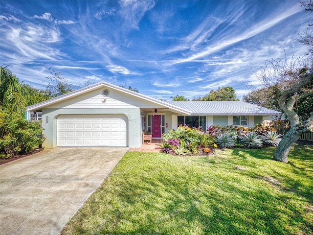 ranch-style house featuring a front lawn and a garage