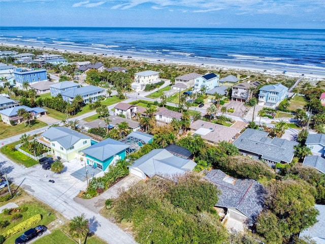 bird's eye view with a view of the beach and a water view