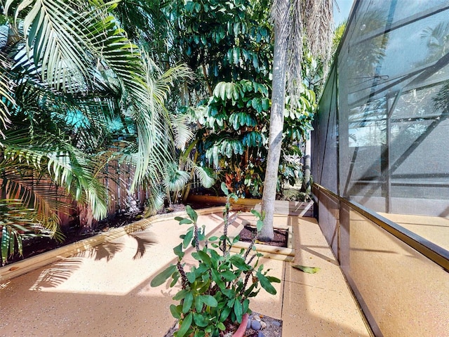 view of patio with a lanai