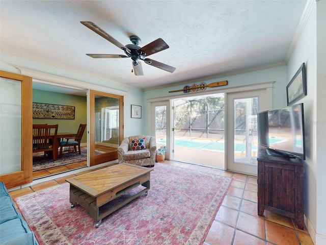 tiled living room with crown molding and ceiling fan