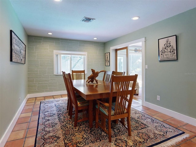 dining space with tile patterned flooring