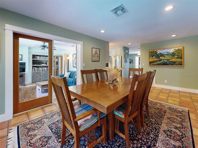 dining room with light tile patterned floors and ceiling fan