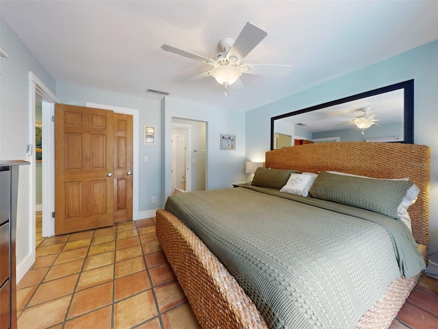 bedroom with light tile patterned floors and ceiling fan