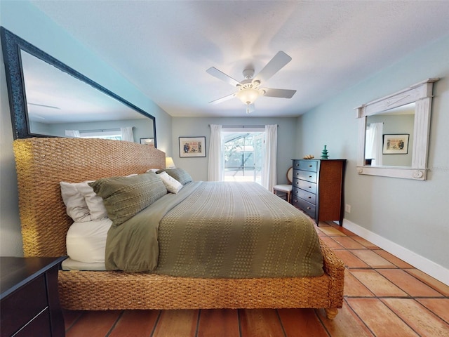 bedroom with tile patterned flooring and ceiling fan