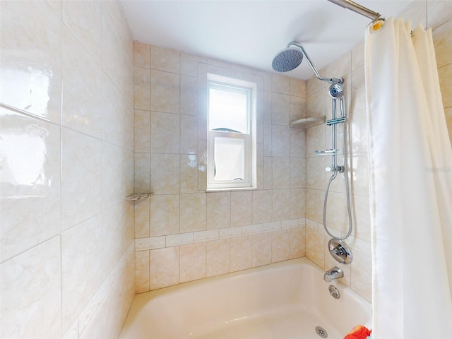 bathroom featuring shower / bathtub combination with curtain