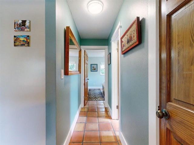 hallway featuring light tile patterned floors