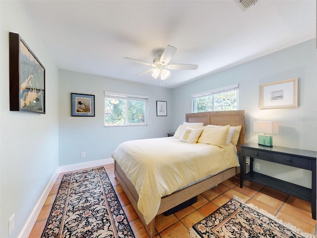 bedroom featuring ceiling fan and light tile patterned floors