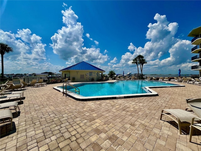 view of swimming pool with a patio