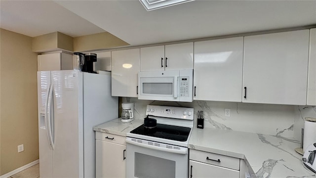 kitchen with white cabinets and white appliances