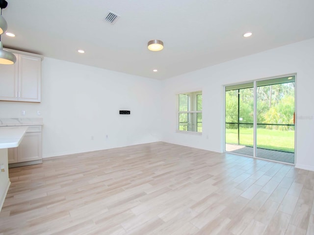 unfurnished living room featuring light hardwood / wood-style floors