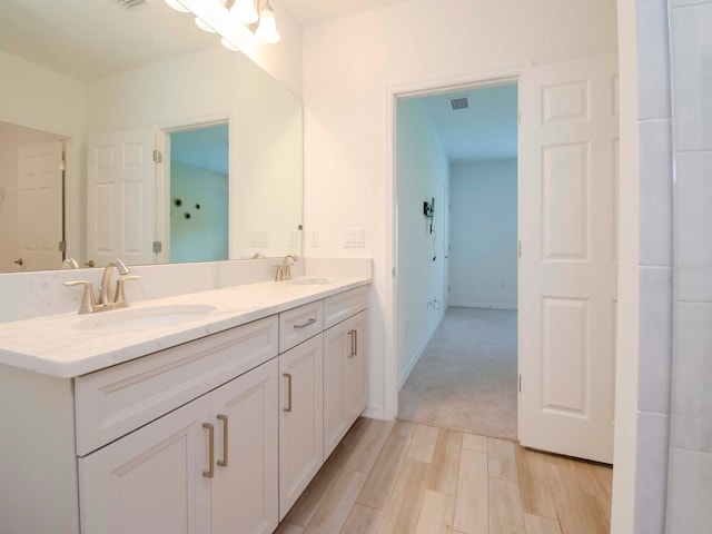 bathroom featuring vanity and hardwood / wood-style floors