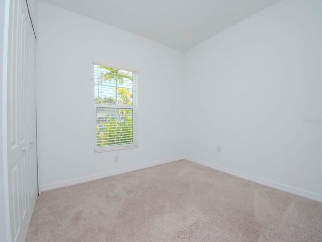 interior space featuring light carpet