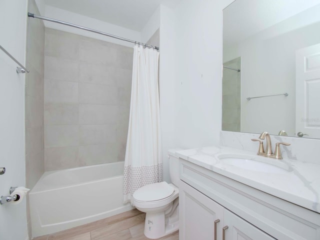 full bathroom featuring shower / bathtub combination with curtain, wood-type flooring, vanity, and toilet