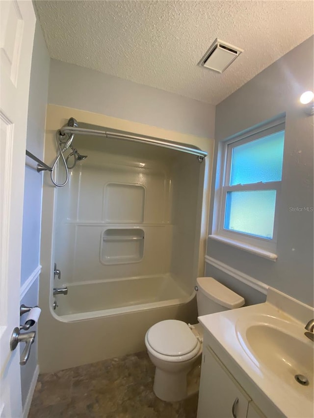 full bathroom with a textured ceiling, vanity, toilet, and shower / bathing tub combination