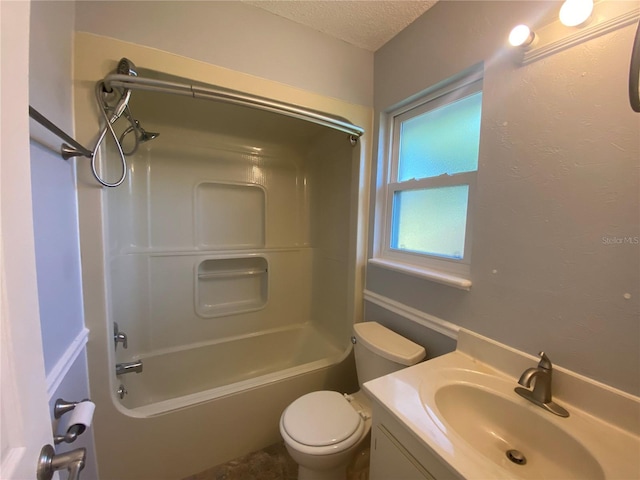 full bathroom with a textured ceiling, vanity, toilet, and bathtub / shower combination