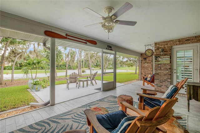 sunroom / solarium with ceiling fan