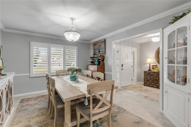 dining room featuring an inviting chandelier and crown molding