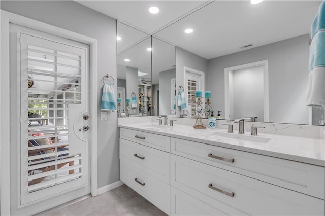 bathroom featuring vanity and tile patterned flooring