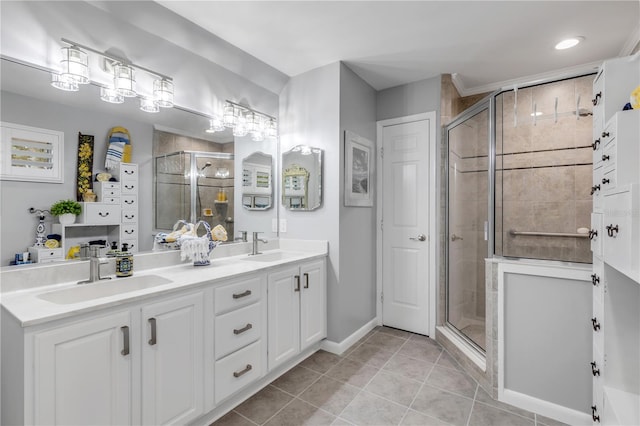 bathroom with vanity, tile patterned flooring, and a shower with door