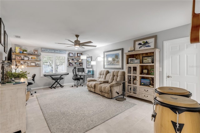 living room with light tile patterned floors and ceiling fan