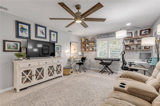 living room with ceiling fan and light tile patterned floors