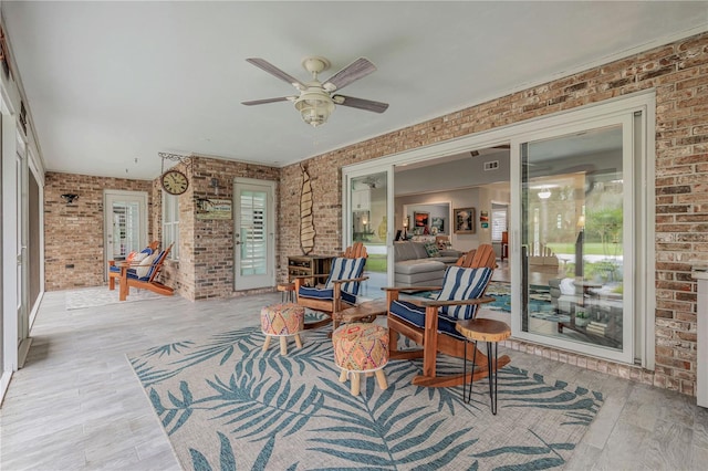 interior space with ceiling fan