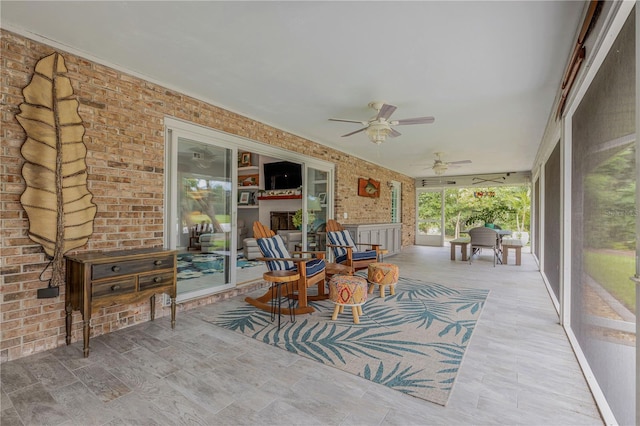 sunroom / solarium with ceiling fan