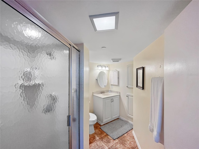 bathroom featuring vanity, toilet, tile patterned floors, and an enclosed shower