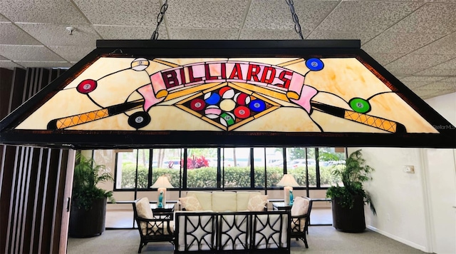 dining area with a paneled ceiling