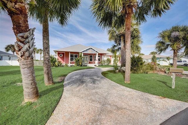 view of front of house featuring a front yard and a porch