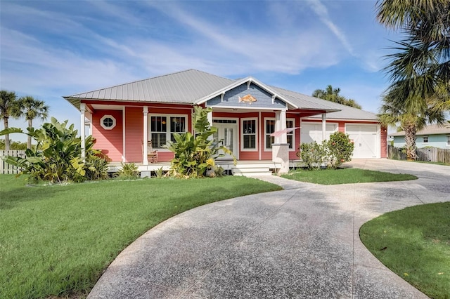 view of front of house featuring a garage and a front lawn