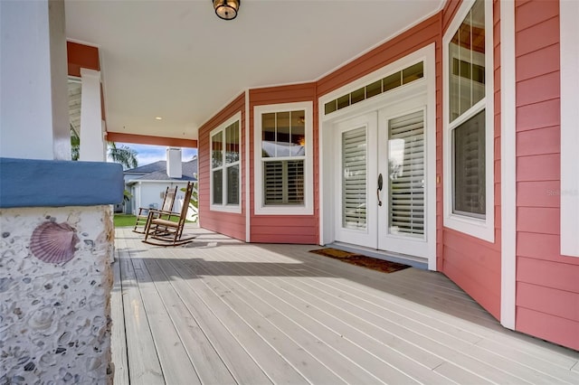 wooden terrace featuring french doors