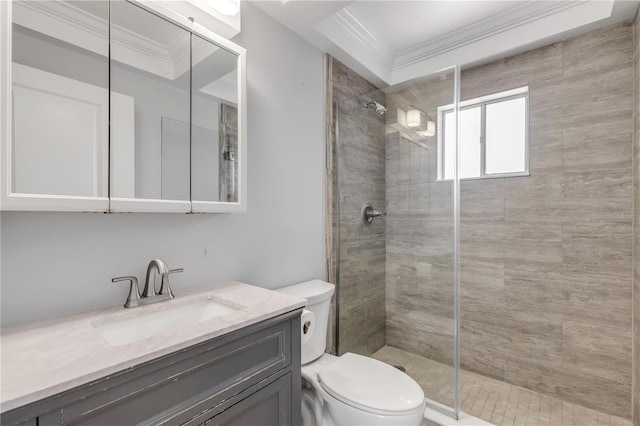 bathroom with an enclosed shower, crown molding, vanity, and toilet