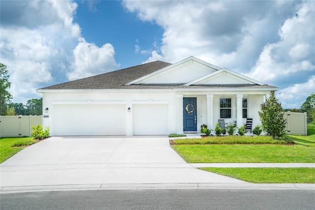 view of front facade featuring a garage and a front yard