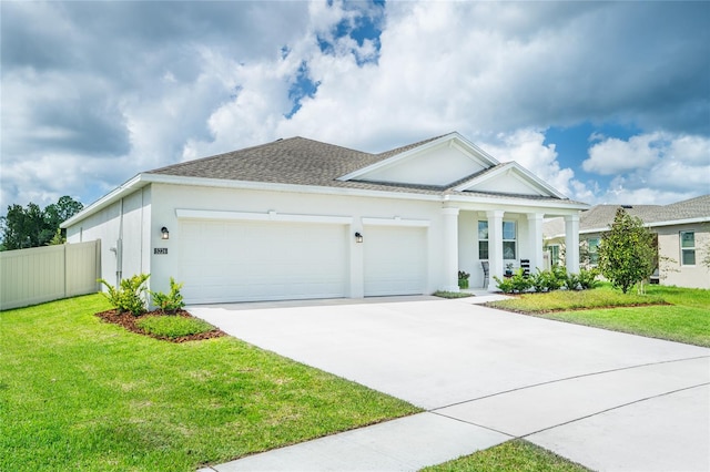 view of front of home with a garage and a front yard