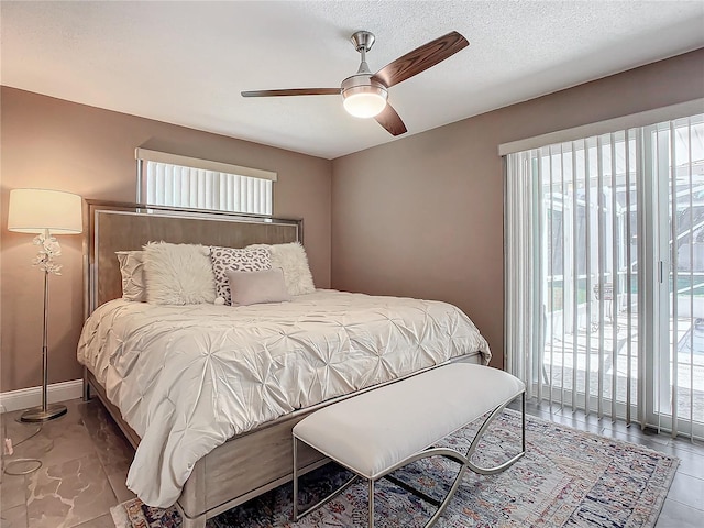 bedroom featuring ceiling fan and access to outside