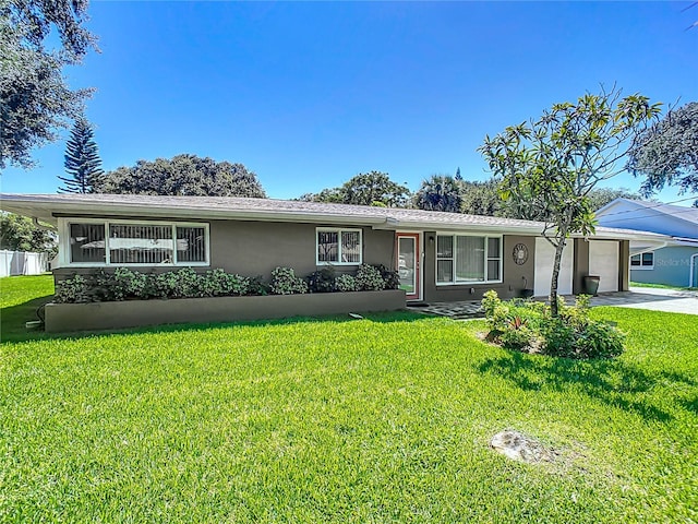 ranch-style house with a front lawn and a garage