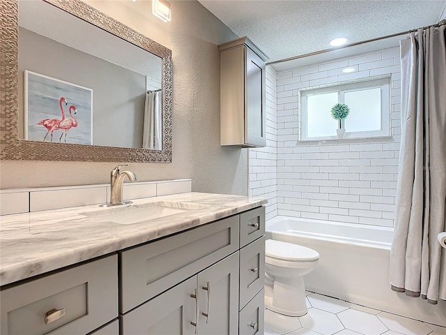 full bathroom with tile patterned floors, a textured ceiling, toilet, shower / tub combo with curtain, and vanity