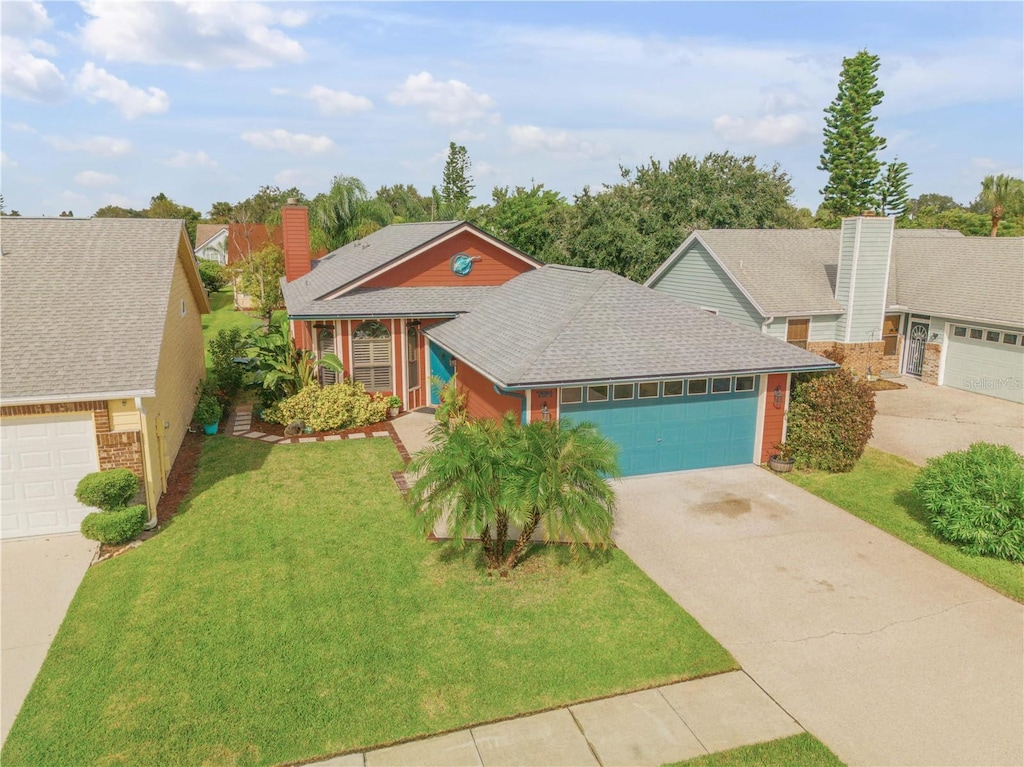 view of front of house featuring a front yard and a garage