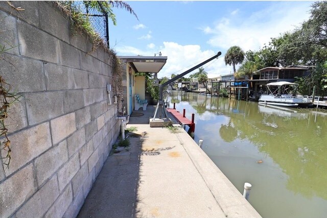 dock area with a water view