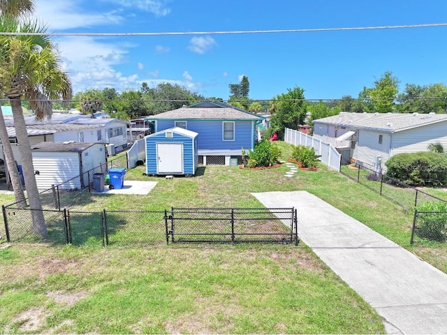 exterior space featuring a storage unit and a front yard