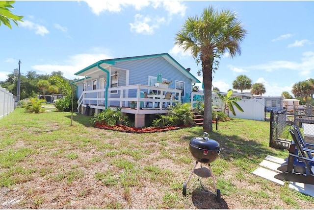 view of yard featuring a wooden deck