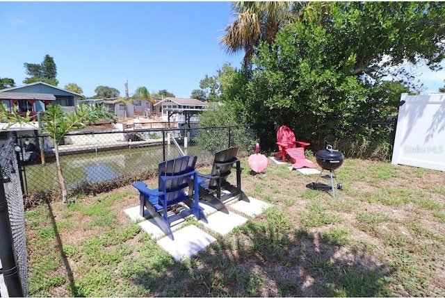 view of yard with a patio and a water view