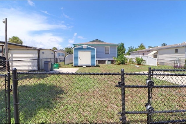 view of front of home featuring a front yard and a shed