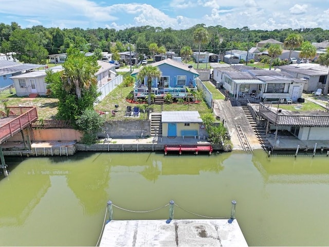 exterior space featuring a deck with water view