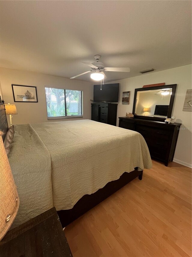 bedroom featuring ceiling fan and light wood-type flooring