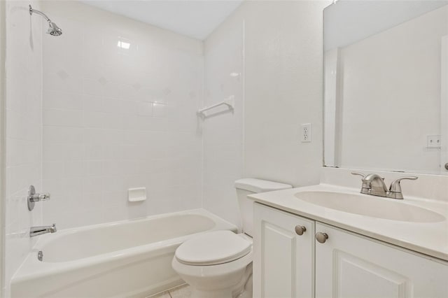 full bathroom with tiled shower / bath, vanity, and toilet