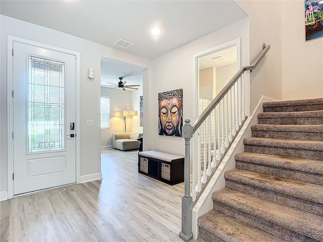 foyer featuring ceiling fan and light hardwood / wood-style floors