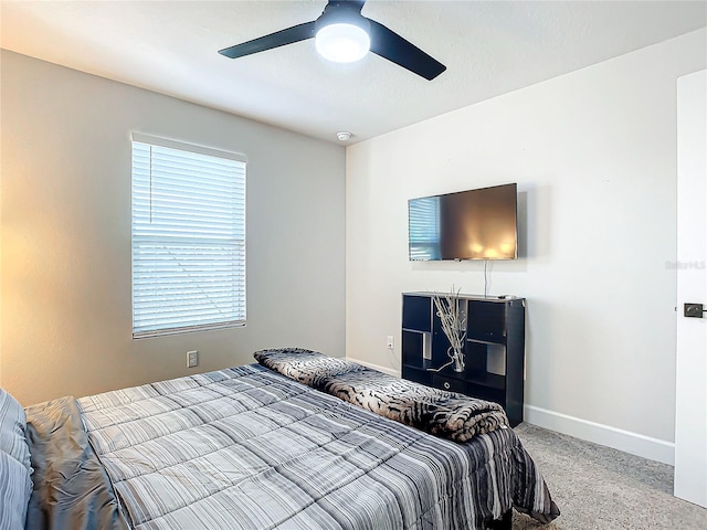 bedroom featuring light carpet and ceiling fan